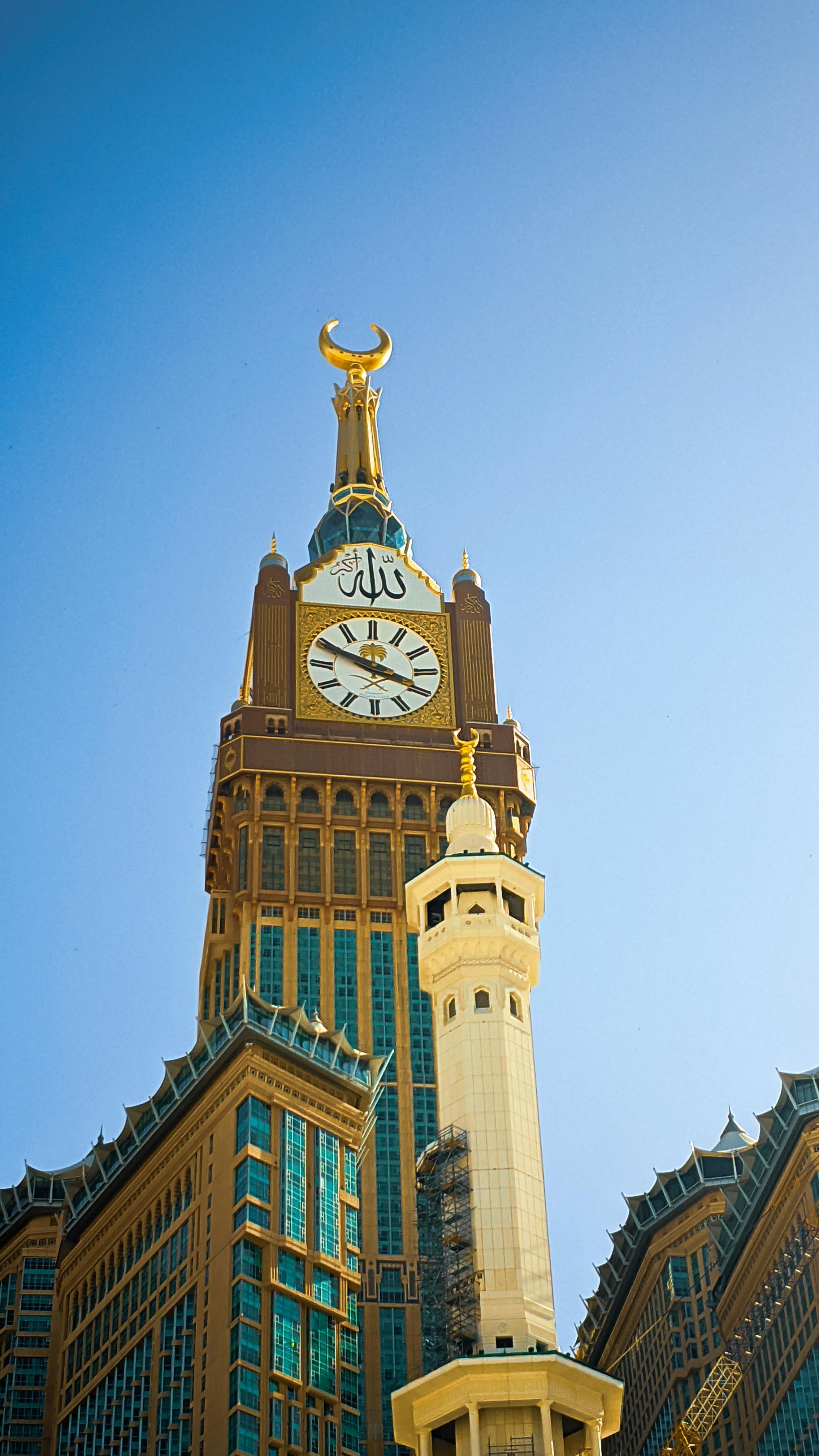 pexels photo 34353004 34353004 Majestic view of Abraj Al Bait clock tower in Mecca with vibrant architecture under a clear blue sky.